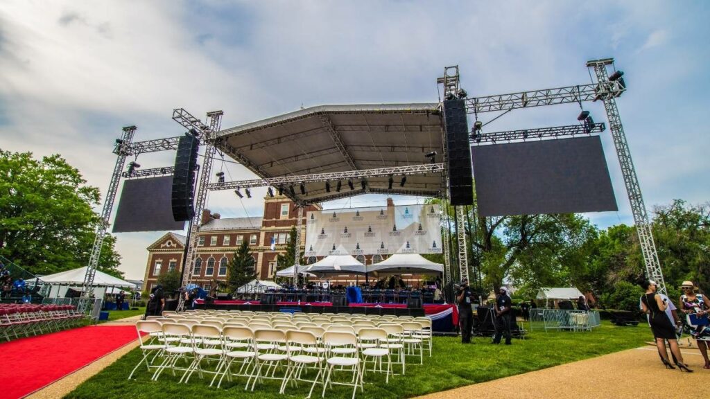 Klassic Sound and Stage large scale set-up including our clair line array, truss roof, modular staging and led video walls.