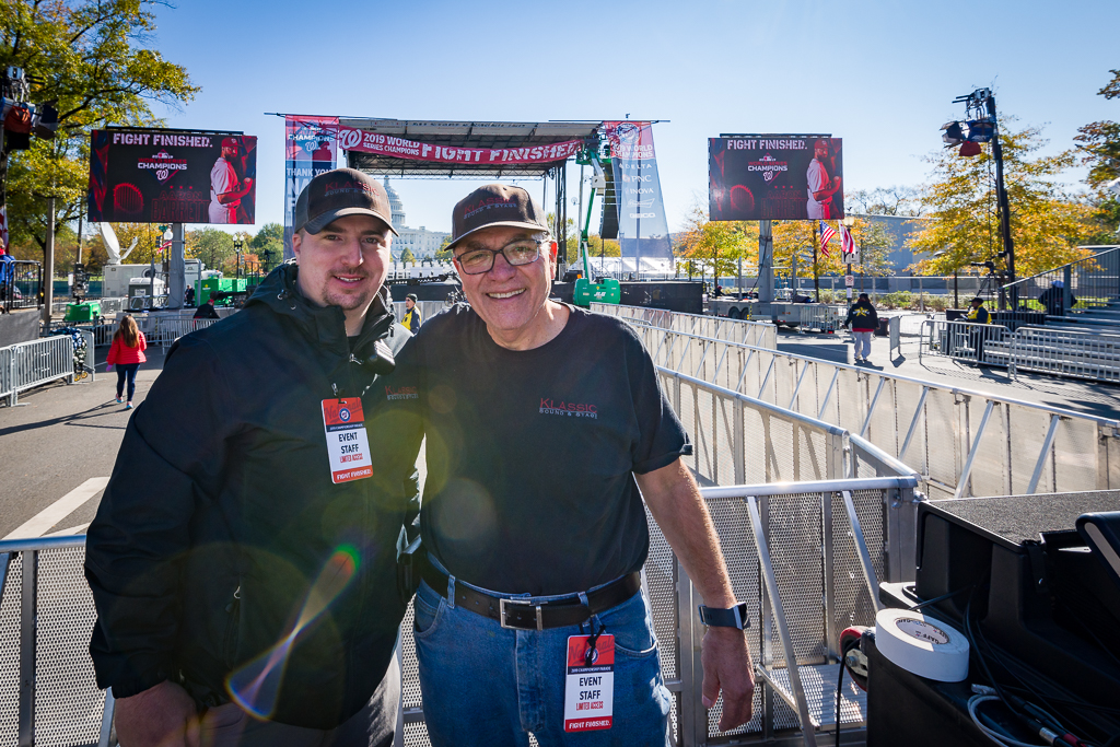 Klassic Sound and Stage employees pose on a front of house riser at the Washington Nationals championship parade celebration in Washington DC